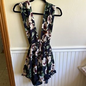 Lulu’s Navy & floral multi way wrap romper with open back